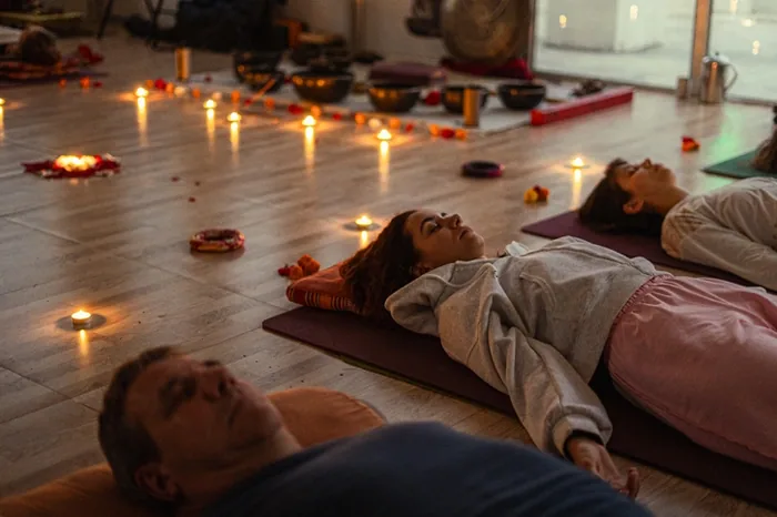 Participants resting on mats during a sound healing session